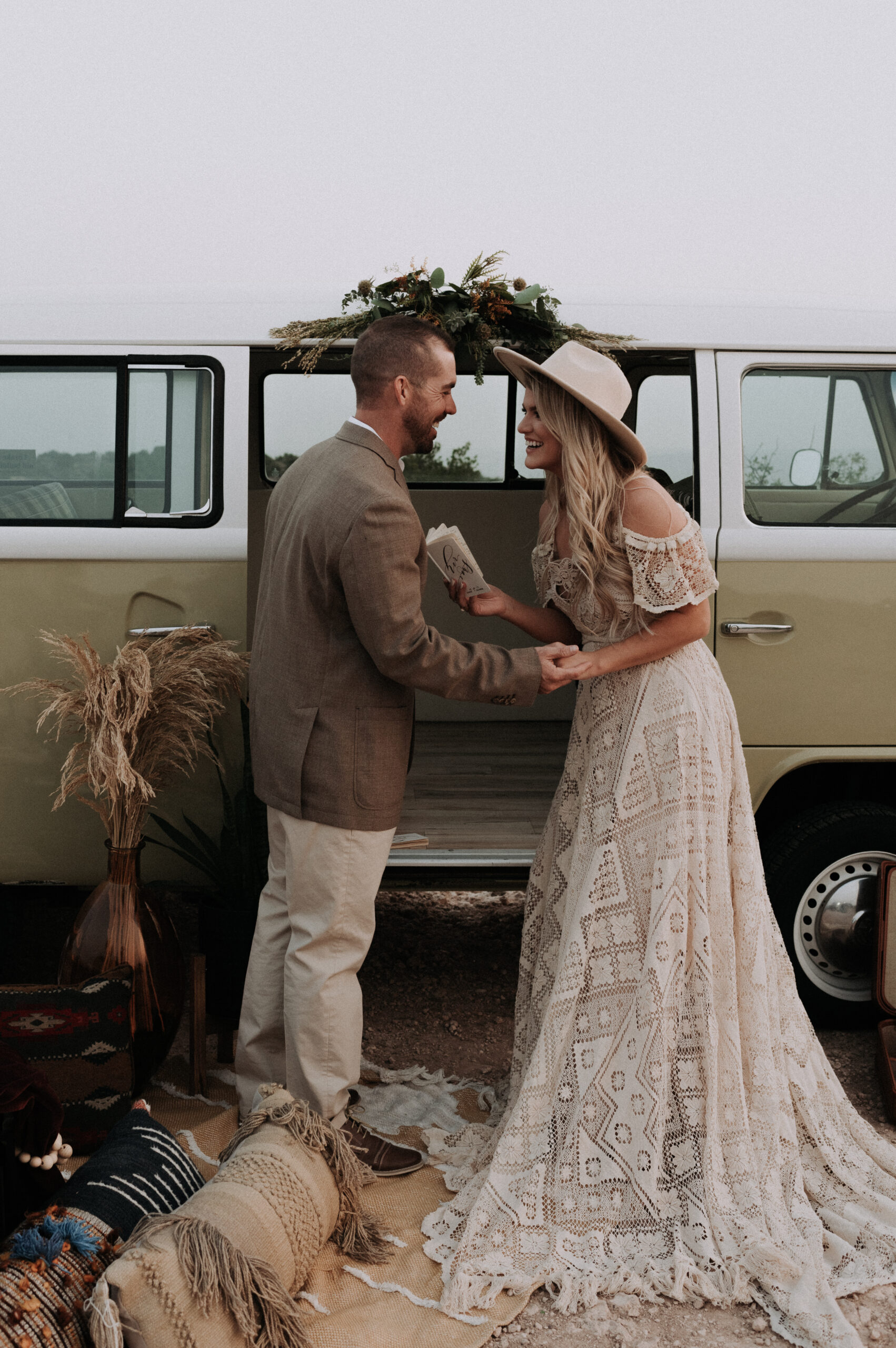 man and woman eloping in canyons, photo of woman holding her vow book for elopement ceremony