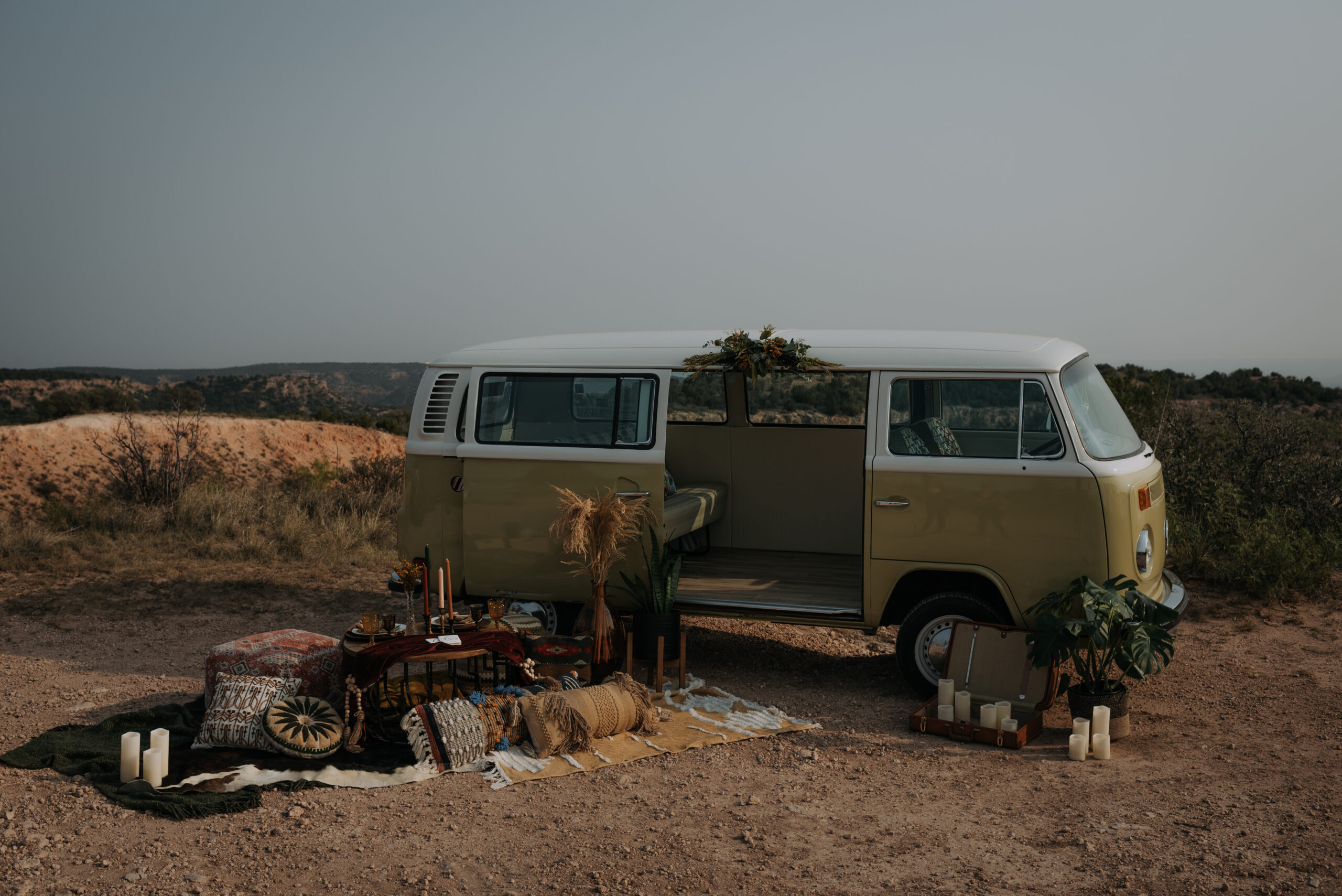 VW van opens with a picnic on side of the van for elopement photos and an elopement ceremony in a canyon. Destination elopement photographer