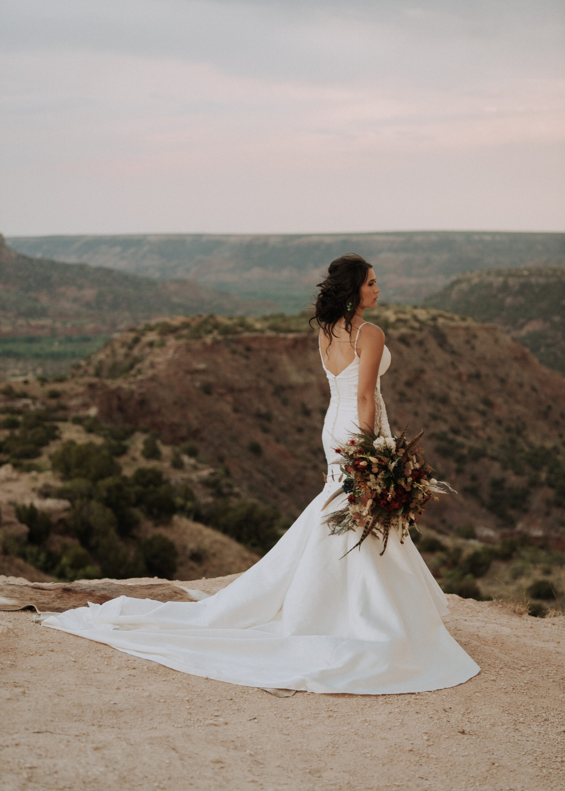 woman looking to right side of desert in Texas while posing for bridal photos, bridal photos, bridal portraits, bride photos, texas wedding photographer, destination wedding