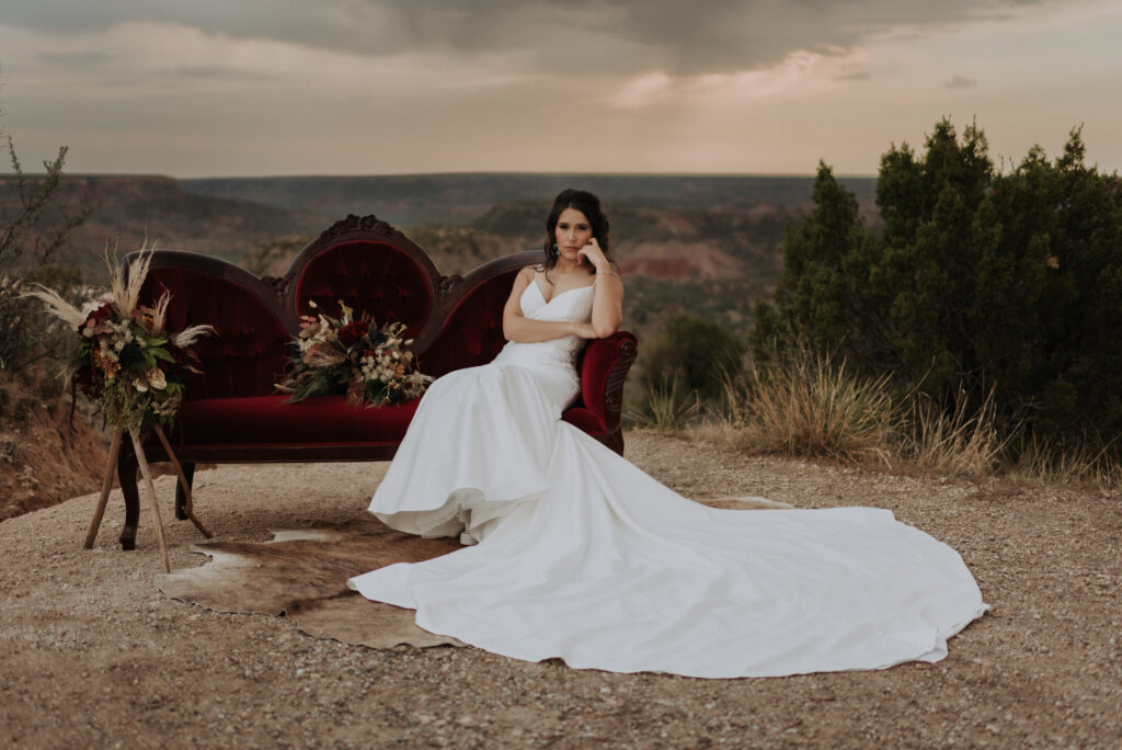 bride posing on couch for bridal portraits, texas wedding photographer